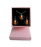 Handcrafted Russian matryoshka Slavic doll dangle cabochon earring and necklace set in silver with black background and red strawberries